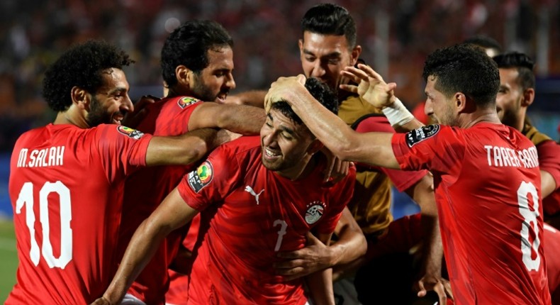 Mahmoud 'Trezeguet' Hassan (C) celebrates scoring the opening goal of the Africa Cup of Nations in Egypt