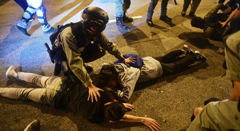 Police detain protesters and students after they attempted to escape from Hong Kong Polytechnic University campus and from police in the Hung Hom district of Hong Kong on November 19