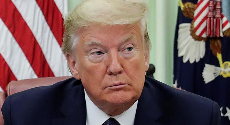 FILE PHOTO: U.S. President Donald Trump is seated prior to signing an executive order regarding social media companies in the Oval Office of the White House in Washington, U.S., May 28, 2020. REUTERS/Jonathan Ernst/File Photo