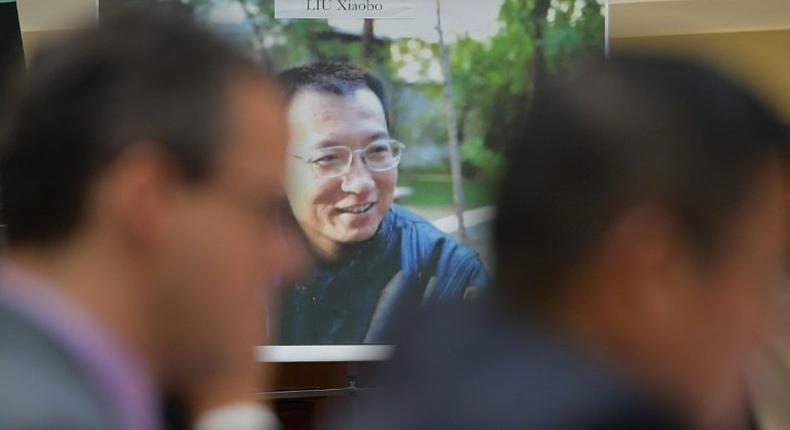 A picture of the late Chinese dissident and Nobel laureate Liu Xiaobo is seen as witnesses testify before a US House subcommittee on his death