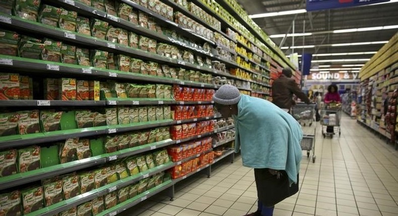 A shopper browses in a branch of South African retailer Pick n Pay at a mall in Soweto, southwest of Johannesburg August 4, 2014. REUTERS/Siphiwe Sibeko