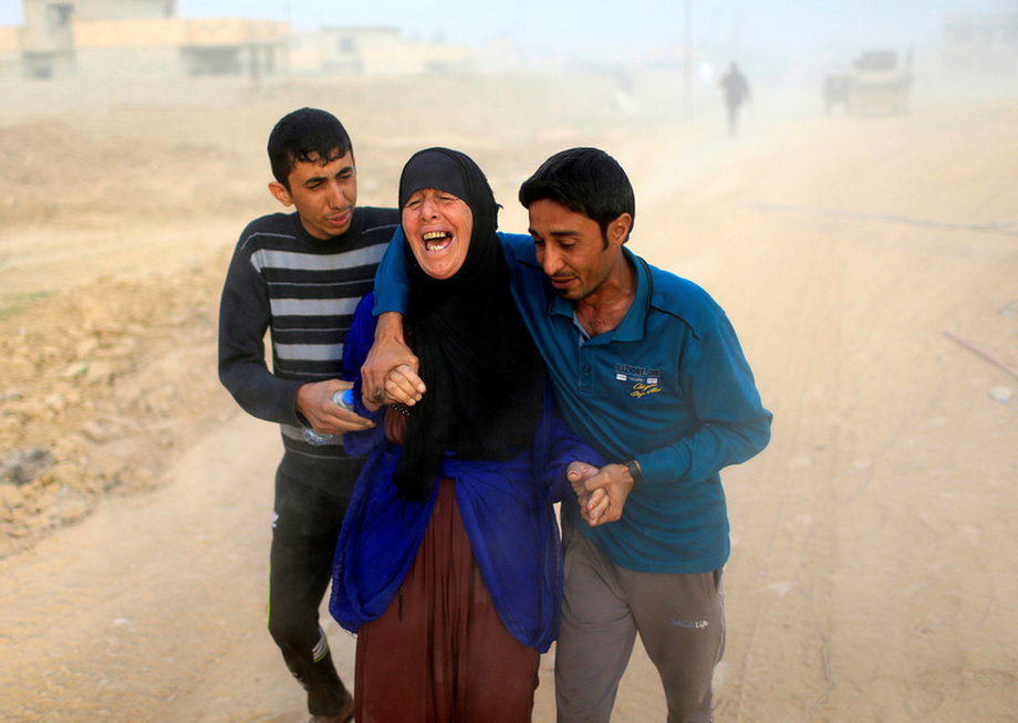 A displaced Iraqi woman cries after she finds out that her 15-year-old son, Maitham, was killed by an ISIS mortar in Samah neighborhood, Mosul, Iraq.