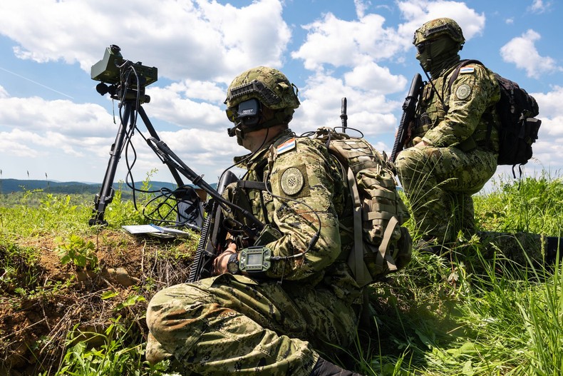 Croatian army special forces joint terminal attack controllers identify a target for US Air Force F-16s during Exercise Trojan Footprint 22 in Croatia, May 11, 2022.