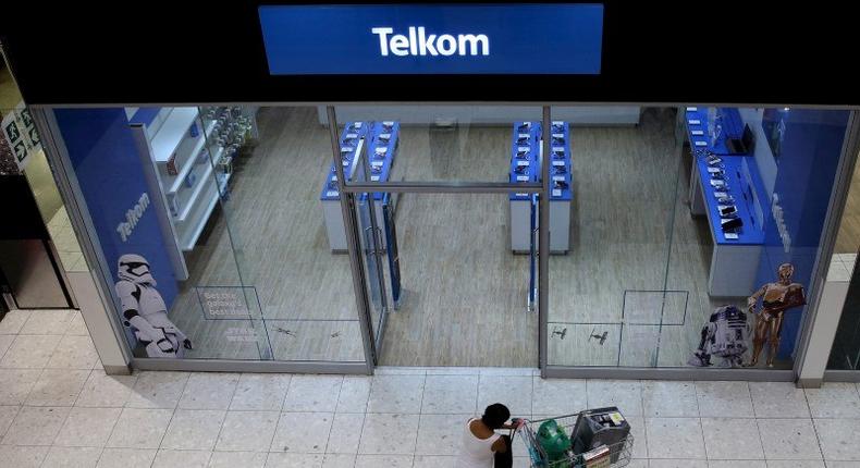 A shopper walks past a Telkom shop at a mall in Johannesburg February 26, 2016. 