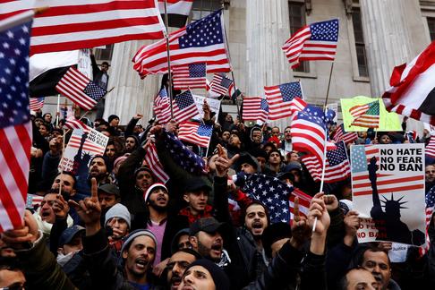 Demonstrators participate in a protest by the Yemeni community against U.S. President Donald Trump's