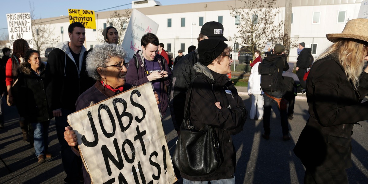 Immigrants-rights supporters rally outside the US Immigration Customs Enforcement (ICE) Northwest Detention Center in Tacoma, Washington, on March 11, 2014.