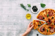 colorful tasty pizza. woman taking piece of italian pizza