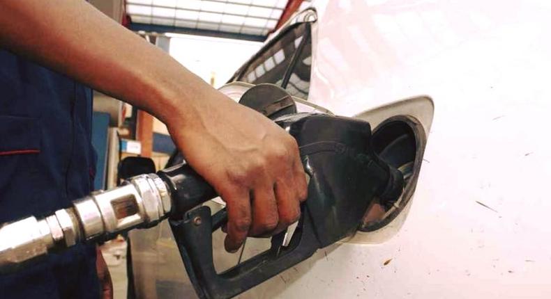 An attendant pumps fuel into a car 