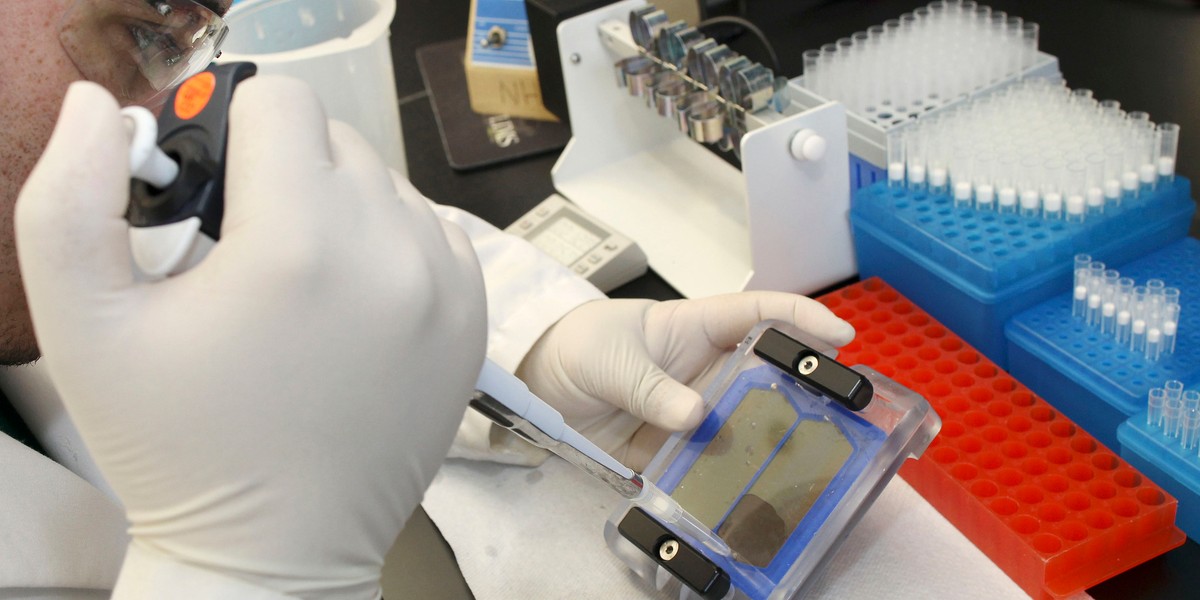 Bio Technician Javier Quinones demonstrates the beginning of the sequencing procedure in the sequencing laboratory at the J. Craig Venter Institute in Rockville, Maryland, March 29, 2010.