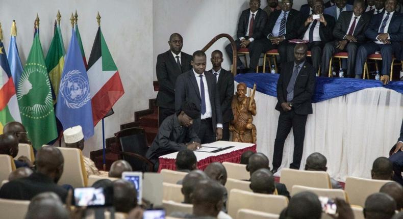 Sidiki Abbas, leader of the 3R armed group claiming to defend the Fulani people, signs the so-called Khartoum Agreement on Wednesday