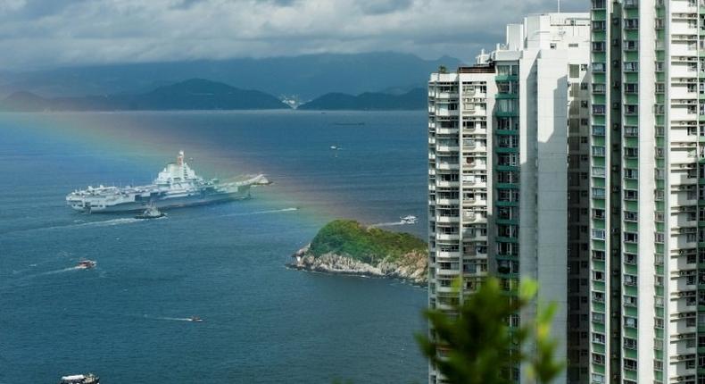 The 305 metre-long (1,000 feet) Liaoning, a secondhand Soviet ship built nearly 30 years ago and commissioned in 2012, arrived in Hong Kong early Friday, as a rainbow appeared overhead.