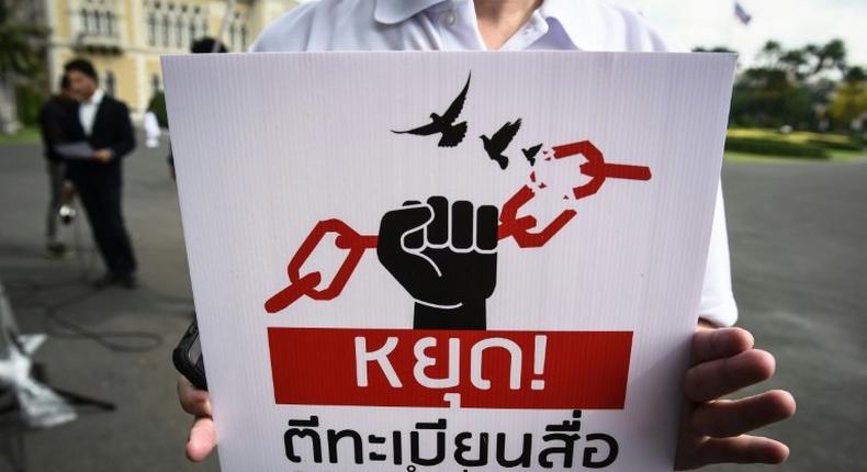 A protest in May against curbs on the Thai media: now a columnist faces charges