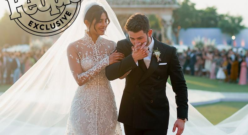 Priyanka Chopra and Nick Jonas in custom Ralph Lauren on their wedding day.