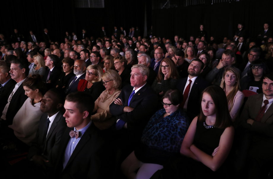 Members of the audience watch as Senator Tim Kaine and Governor Mike Pence debate.