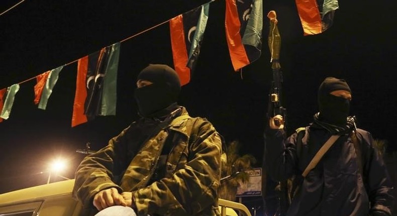 Members of a heavily-armed militia group hold their weapons in Freedom Square in Benghazi February 18, 2014.   
REUTERS/Esam Omran Al-Fetori