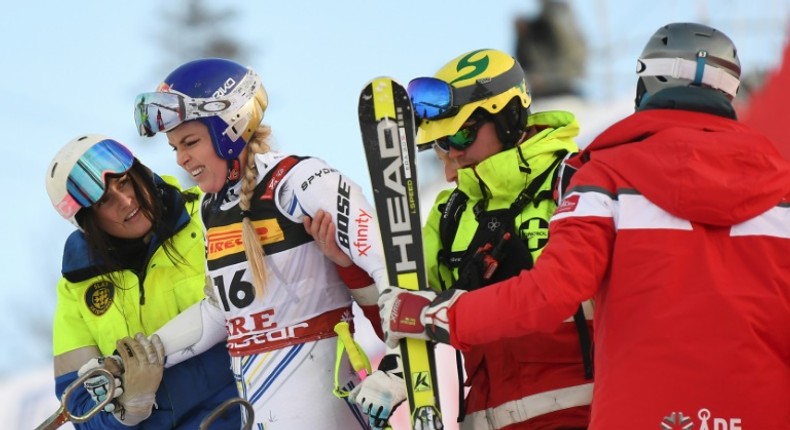 Lindsey Vonn was helped to her feet after careering into the safety netting