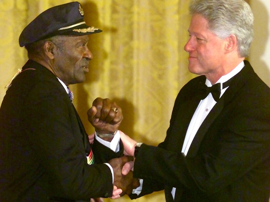 U.S. President Bill Clinton shakes hands with Kennedy Center Award honoree Chuck Berry during a ceremony in the East Room of the White House in Washington December 3, 2000.