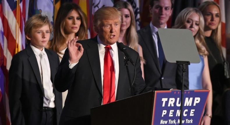 Republican presidential nominee Donald Trump arrives on stage with his family to speak to supporters during election night in New York on November 9, 2016