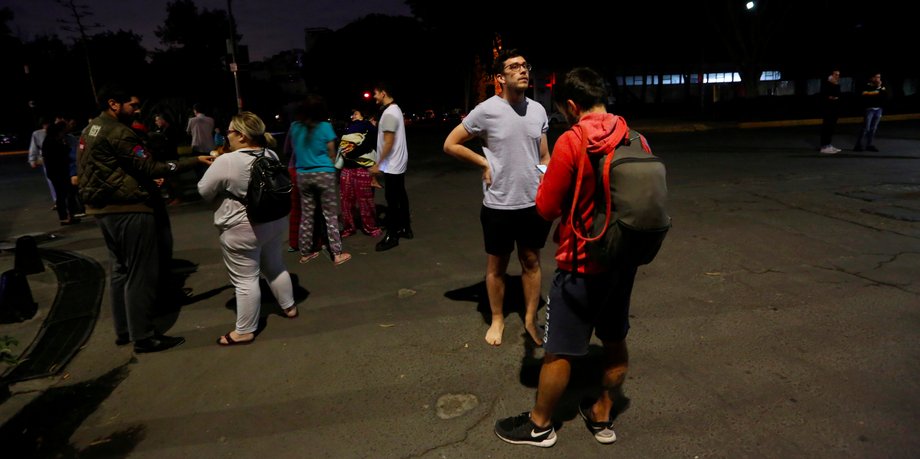 People gathered on a street after an earthquake hit Mexico City.