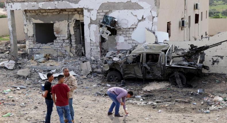 General view shows damage at the scene of an explosion at the Mislattah checkpoint near Khoms, on the coast road between Tripoli and Misrata Libya November 24, 2015. REUTERS/Stringer