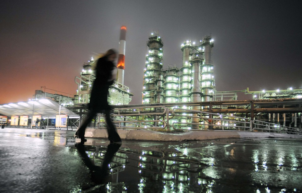 A man walks in front of Novokuibyshevsk refinery near the city of Samara