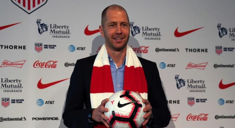 Coach Gregg Berhalter poses after he was introduced as the new US football national team head coach during a press conference at The Glasshouses in New York City