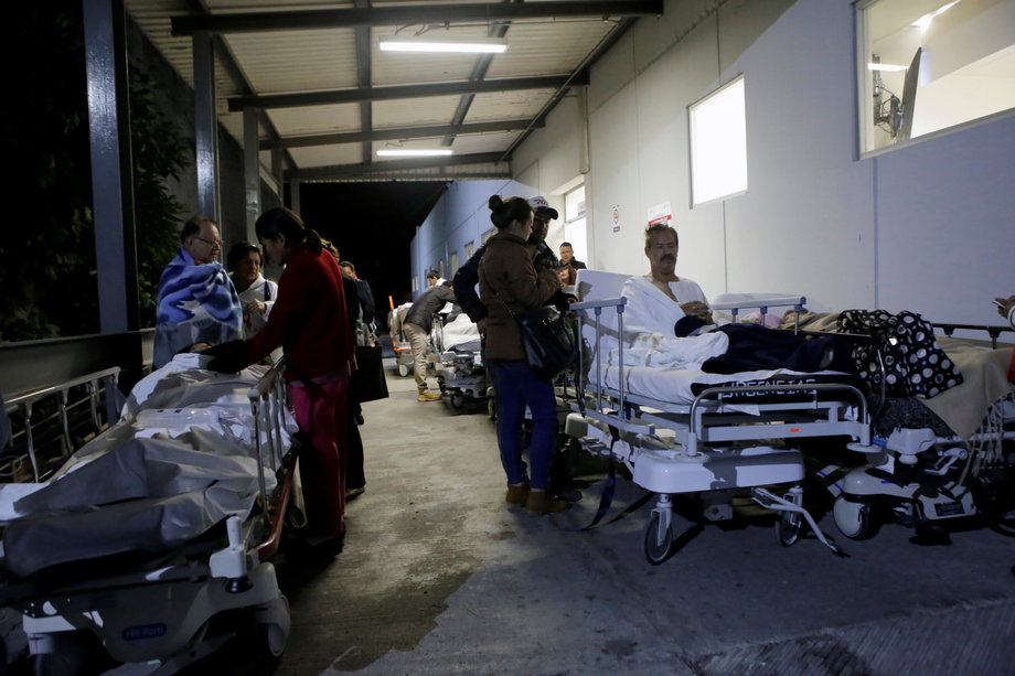 Evacuated patients wait outside a specialist hospital in Puebla, central Mexico, after the quake hit.