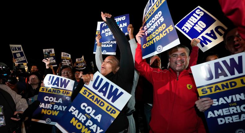 Striking United Auto Workers picket at Ford's Michigan Assembly Plant in Wayne, Mich., shortly after midnight Friday, Sept. 15, 2023.Paul Sancya/Associated Press