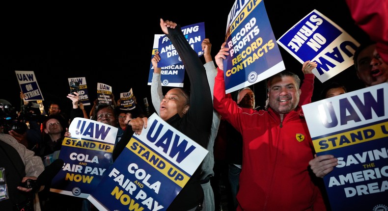 Striking United Auto Workers picket at Ford's Michigan Assembly Plant in Wayne, Mich., shortly after midnight Friday, Sept. 15, 2023.Paul Sancya/Associated Press