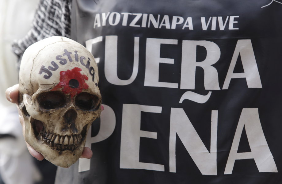 A march in Mexico City in November marking the 14-month anniversary of the disappearance of the students from Ayotzinapa College. The skull reads" Justice," and the words on right read "Peña out," referring to Peña Nieto.