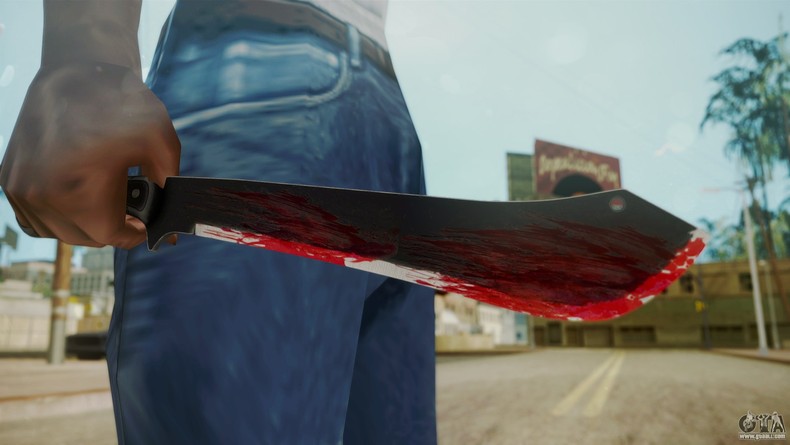 File photo: Man holding bloody machete