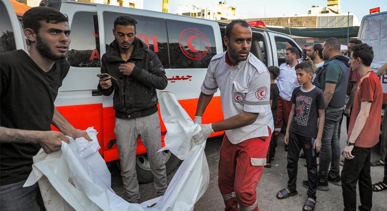 The body of a victim killed in an Israeli bombardment is taken out of an ambulance in Gaza City.DAWOOD NEMER/AFP via Getty Images
