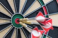 Close-Up Of Arrows In Dartboard