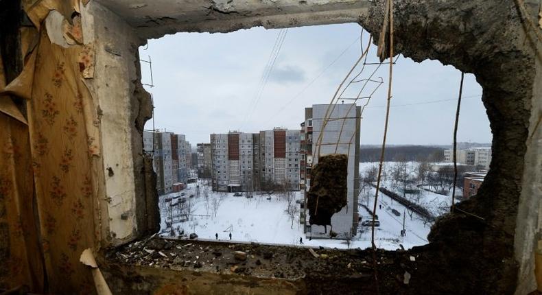 This file photo taken on December 1, 2014 shows destroyed buildings in the eastern Ukrainian city of Donetsk. The UN's top court will on April 19 rule on a bid by Kiev to halt Russia's alleged funnelling of arms and personnel into Ukraine's war-torn east