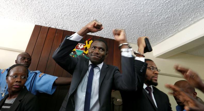 A policeman leads the handcuffed officials of the Kenya Medical Practitioners, Pharmacists and Dentist Union (KMPDU) on February 13, 2017 in Nairobi.