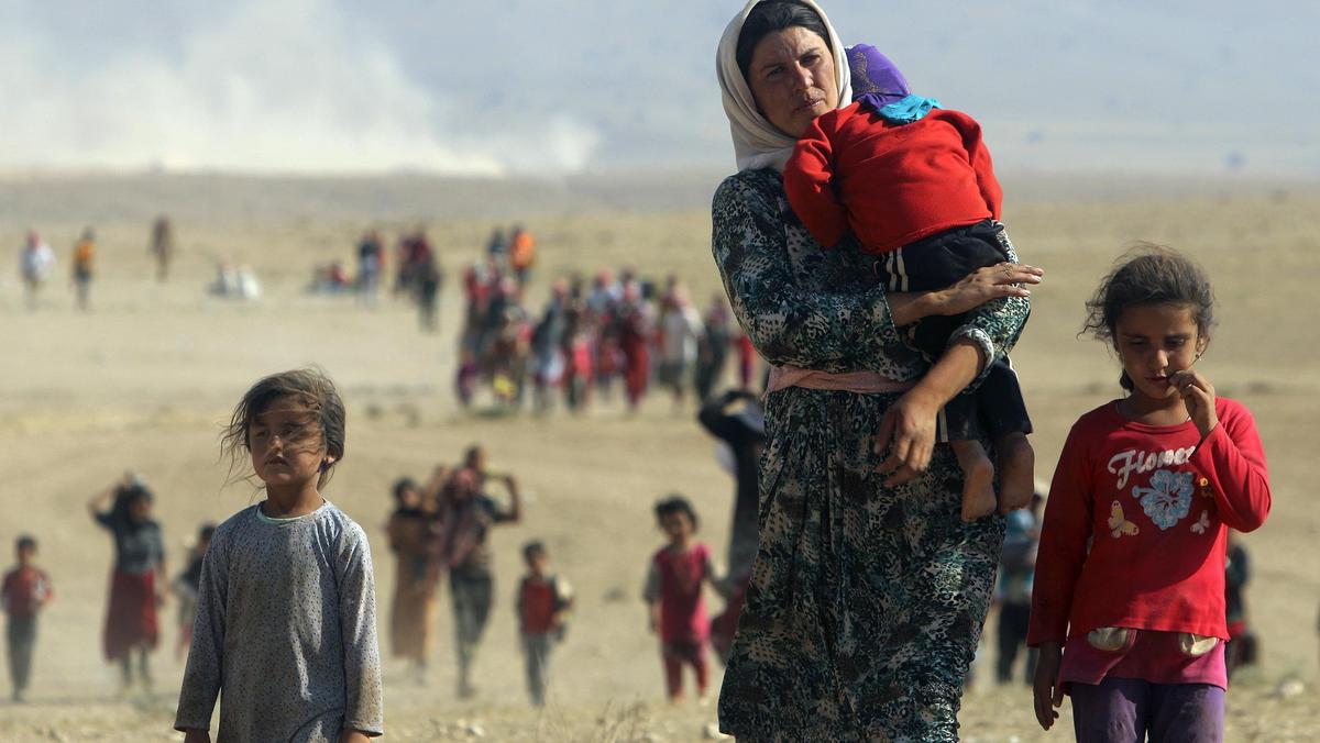 File photo of displaced people from the minority Yazidi sect, fleeing violence from forces loyal to 