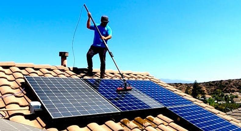 Cleaning solar panels.