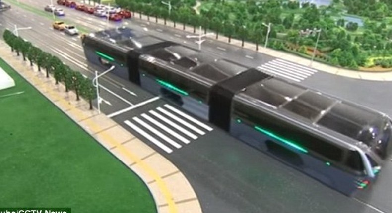 The scale model of the 'Transit Elevated Bus' was demonstrated this week at the 19th China Beijing International High-Tech Expo (pictured). The idea is that passengers sit far above other vehicles on the road, allowing cars to pass underneath 