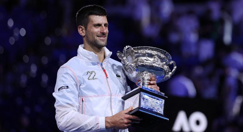 Novak Djokovic poses with his 2023 Australian Open trophy.REUTERS/Loren Elliott