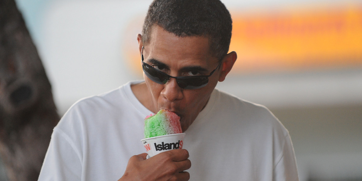 US President Barack Obama enjoys a "Snowbama" shave ice at Island Snow on January 1, 2010, in Kailua, Hawaii.
