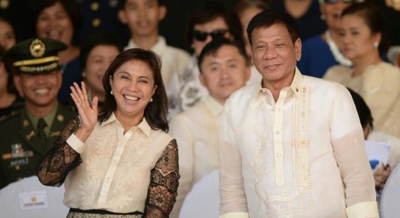 Philippines President Rodrigo Duterte (right) poses for photographs with Vice-President Leni Robredo in Manila on July 1, 2016