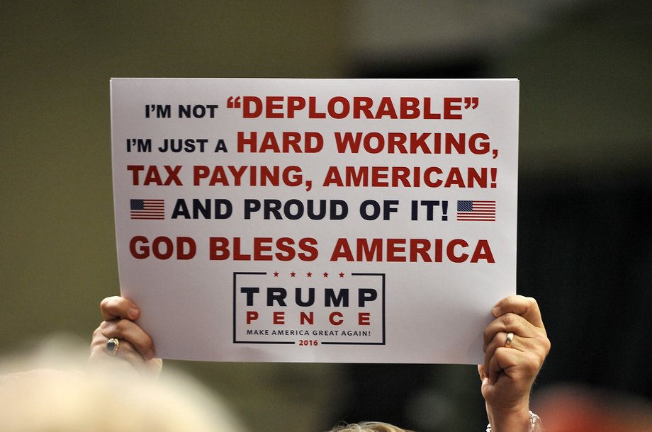 A supporter of Republican Presidential nominee Donald Trump holds a sign at a campaign rally on September 13, 2016 in Clive, Iowa.