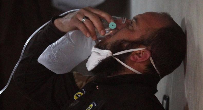 A civil-defence member after what rescue workers described as a suspected gas attack in the town of Khan Sheikhoun in Syria's rebel-held Idlib province on Tuesday.