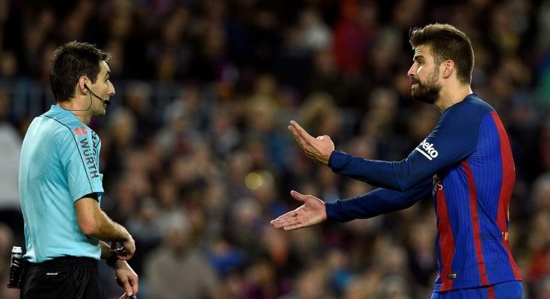 Barcelona's defender Gerard Pique (R) Pique is Barca's best defender, leader, possible future president and principal provocateur to the Madrid fans and media