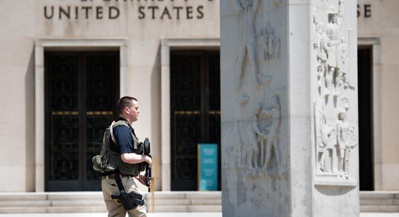 A US marshal patrols outside the E. Barrett Prettyman United States Courthouse in Washington, DC.Sarah L. Voisin/The Washington Post via Getty Images
