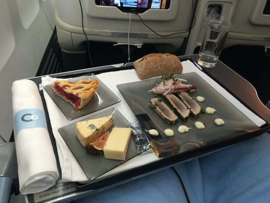On our return flight, which left London at 5:40 p.m. (London time) and arrived in Newark at 8:00 p.m. (Eastern time), we were served a light first course of tuna, a cheese and fig plate, and some sort of pie around 6:00 p.m. It was all surprisingly delicious.