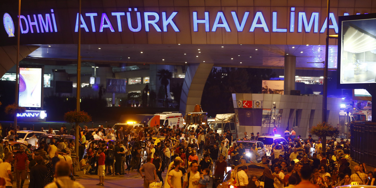People leave Turkey's largest airport, Istanbul Ataturk, after a blast on June 28.