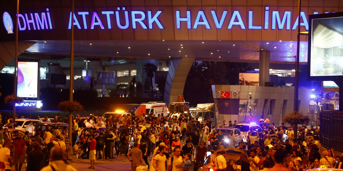 People leave Turkey's largest airport, Istanbul Ataturk, after a blast on June 28.