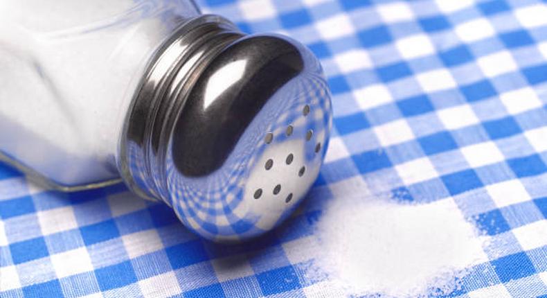 Close up of a pile of salt on a table cloth