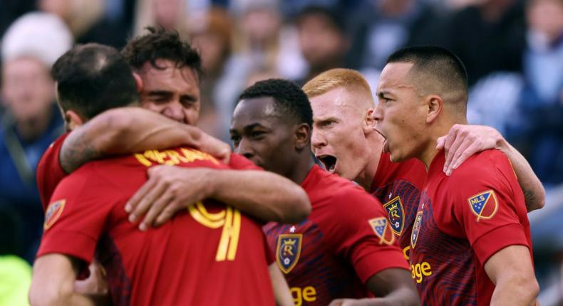 Real Salt Lake's Bobby Wood is congratulated by teammates after scoring the injury-time winner in a 2-1 MLS Cup playoff win over Sporting Kansas City Creator: JAMIE SQUIRE